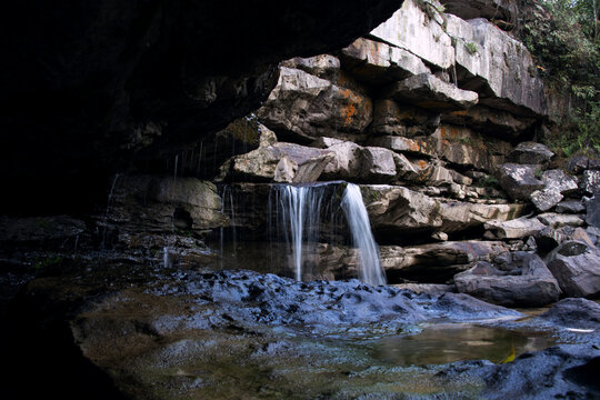 Landscape of a waterfall under a cliff