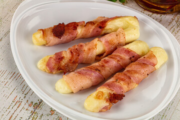 Hot mozzarella sticks with bacon