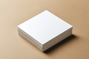 Fototapeta premium Blank sheets stacked neatly on minimalistic background, emphasiz