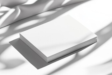 Minimalist design showcases blank pages illuminated by soft shad