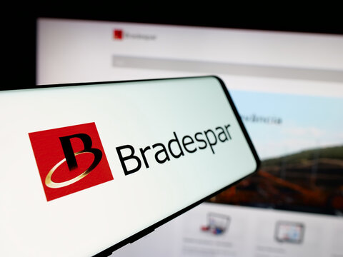 Stuttgart, Germany - 12-13-2024: Mobile phone with logo of Brazilien holding company Bradespar SA on screen in front of business website. Focus on left of phone display.