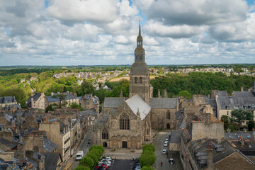 Fototapeta premium View of the Basilica of Saint-Sauveur from the observation deck of the Dinan Clock Tower on a sunny summer day, Dinan, Cotes-d'Armor, Brittany, France