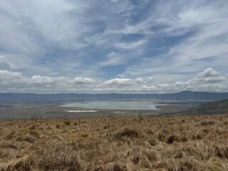 landscape with impressive dramatic clouds in the landscape of the ngorongoro crater tanzania safari, savannah steppe grass safari wildlife