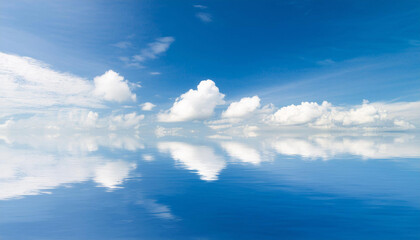 Obraz premium Blue Sky and Clouds Reflecting in Water and Copy Space