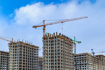 Construction of the third stage of a new residential complex 'in the forest'. Work construction cranes, is the construction of walls of buildings. Moscow, Russia