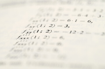 Mathematical Equations and Derivatives on White Paper Background