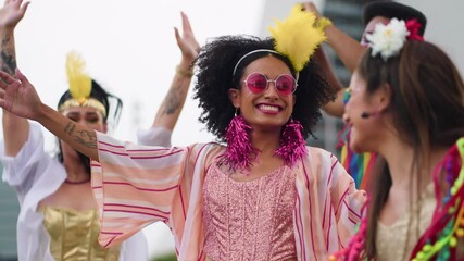 Joyful Brazilian Carnival Celebration with Women in Vibrant Costumes Dancing in the Street. Group of Happy Friends Enjoying Traditional Carnaval Festivities Outdoors