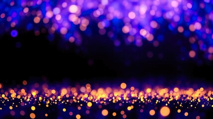 A luxurious abstract background of glittering lights in a de-focused style, combining deep blue and gold tones over a black base.