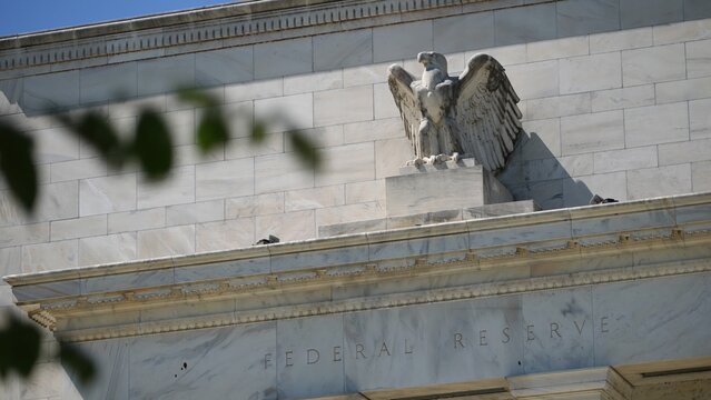 The Federal Reserve building in Washington DC features a prominent eagle sculpture, representing American finance and the central bank's role in the economy.