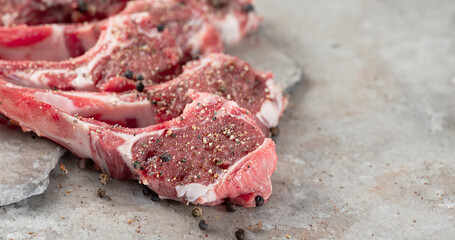 Raw lamb ribs seasoned with various spices © mnimage