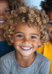 A Portrait of a Young Boy Smiling-Blode Curly Hair-Smiling Expression