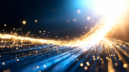 Fototapeta premium Abstract golden particles swirling on a dark blue background.