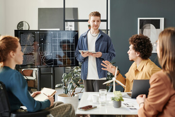 Engineer discussing green energy projects in office