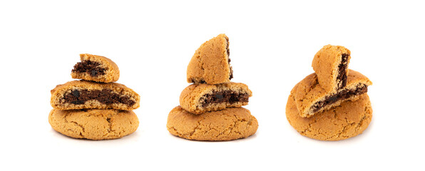 Chocolate cookies with chocolate filling isolated, brown round biscuits, broken sweet cocoa pastry