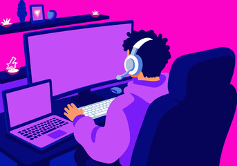Teenager boy engaging in online gaming sitting at desk with multiple screens