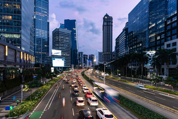 Naklejka premium Jakarta, Indonesia: Traffic during rush hour along the Sudirman avenue in the heart of Jakarta business and financial district in Indonesia capital city.