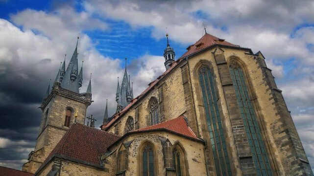 Close-up of the tower of the Church of Our Lady before Tyn. The spiers of the ancient European historical cathedral in Prague. Landmark against the sky.
