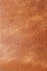 Brown leather texture. Material: genuine leather, eco-leather background. Texture of soft brown cowhide close-up. Fashion, style, material.