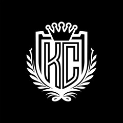 KC Letter logo heraldic shield shape with crown on black background template design