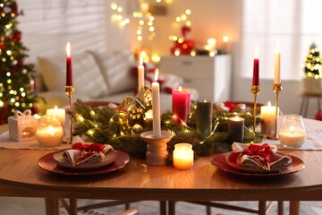 Festive table setting in room decorated for Christmas. Bokeh effect