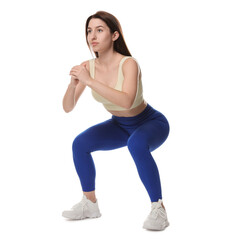 Woman in sportswear exercising on white background