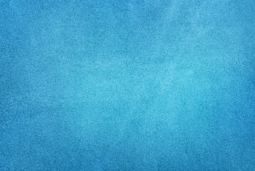 Light blue suede background with dark edge.