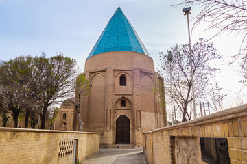 Gonbad Sabz Garden in early spring and one of the medieval mausoleums that is its highlight. Shot...
