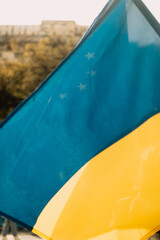 Ukrainian and European Union flags at a rally against the war