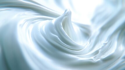Obraz premium Smooth and Silky White Cream Swirls on a Light Background