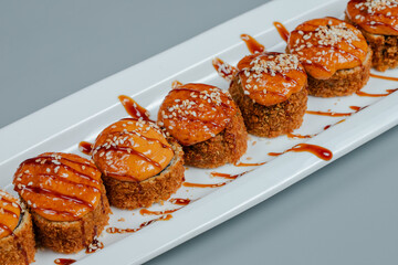 Sushi rolls on white plate