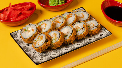 Nigiri on colorful plate close up