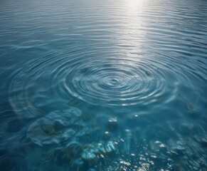 Obraz premium Calm water surface with circular ripples in clear blue water, peaceful scene, serenity