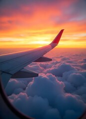 Obraz premium A plane wing extends over sunset-lit clouds, evoking flight's serene beauty.