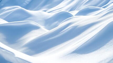 Obraz premium Snowy landscape with soft undulating drifts creating a serene and tranquil winter scene highlighting the beauty of fresh snowfall.