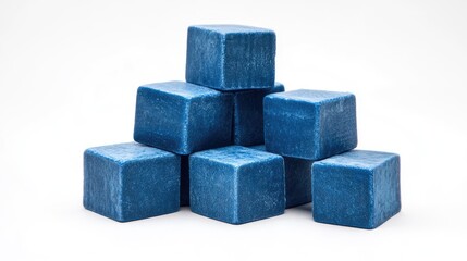 Fototapeta premium Stack of blue cubes arranged on a white background showcasing geometric shapes and modern design from an angled side perspective.