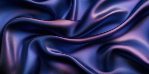 Obraz premium A close-up of flowing, rich purple satin fabric showcasing smooth textures and elegant drapes.