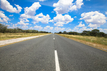 The Trans-Kalahari Corridor is a paved highway corridor that provides a direct connection from the port of Walvis Bay and Windhoek in central Namibia. Endless long asphalt road. Namibia Africa.