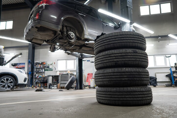 Changing tires for a car according to the season. 