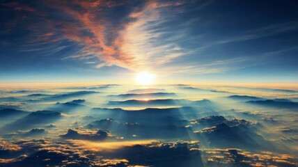 Fototapeta premium Beautiful sunrise over clouds with radiant light spreading across the sky