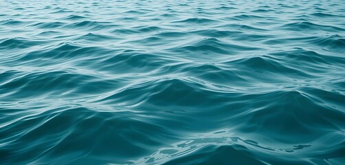 Fototapeta premium A close-up view of rippling teal water.