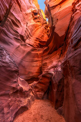 Antelope Slot Canyon Passageway shows the opening at the top where floodwater and rain enter to continue its erosion.
