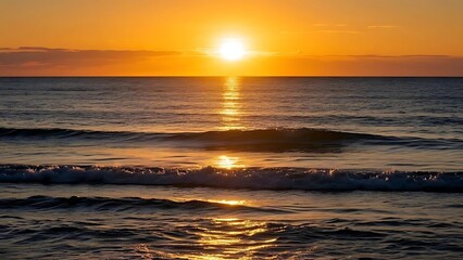 Obraz premium A panoramic view of ocean at sunset, with sun casting a golden glow on water