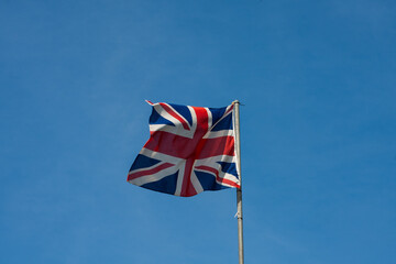 Union Jack flag against a blue sky