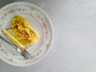 Delicious French Toast with Omelette on a Floral Plate