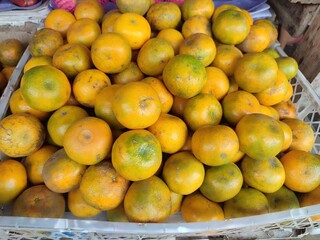 close up of a ripe sweet orange that is yellow in color