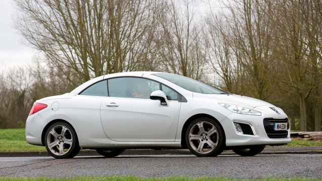2012 Peugeot Allure 308  car driving on an English country road.
