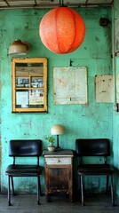 Vintage interior with teal walls, orange lantern, and rustic furniture creating a cozy vibe.