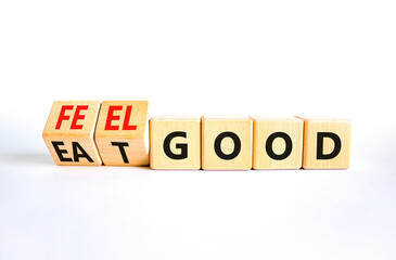 Eat and feel good symbol. Concept words Eat good Feel good on wooden cubes. Beautiful white table white background. Healthy lifestyle eat and feel good concept. Copy space.