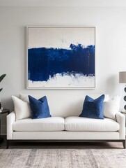 Abstract Blue Artwork Above White Sofa In Modern Room