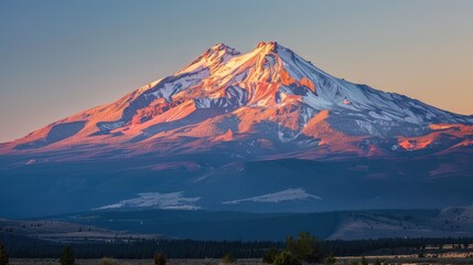 Majestic Mountain Peak Bathed in Golden Light at Sunrise